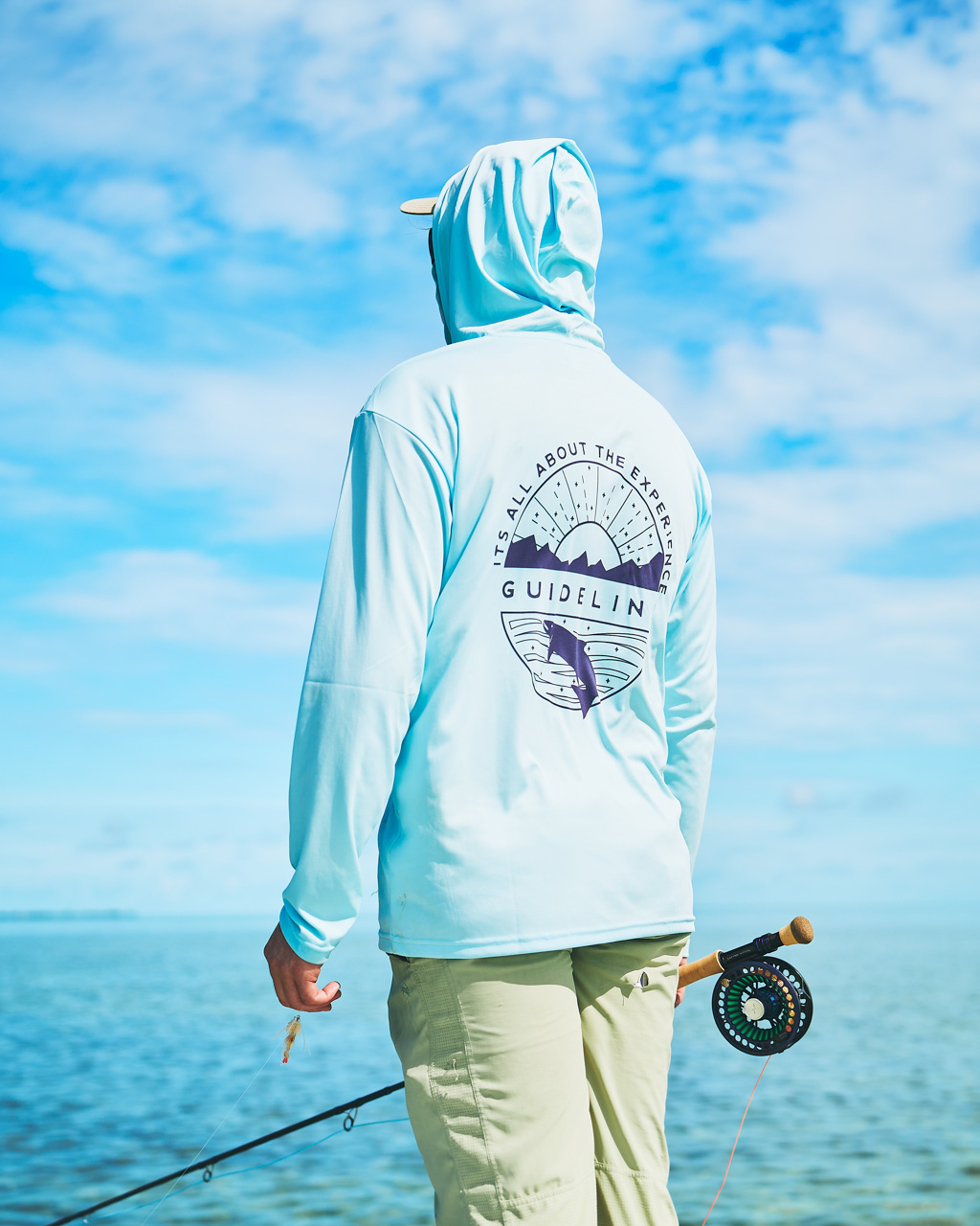 Tarpon fly angler on a skiff looking for fish